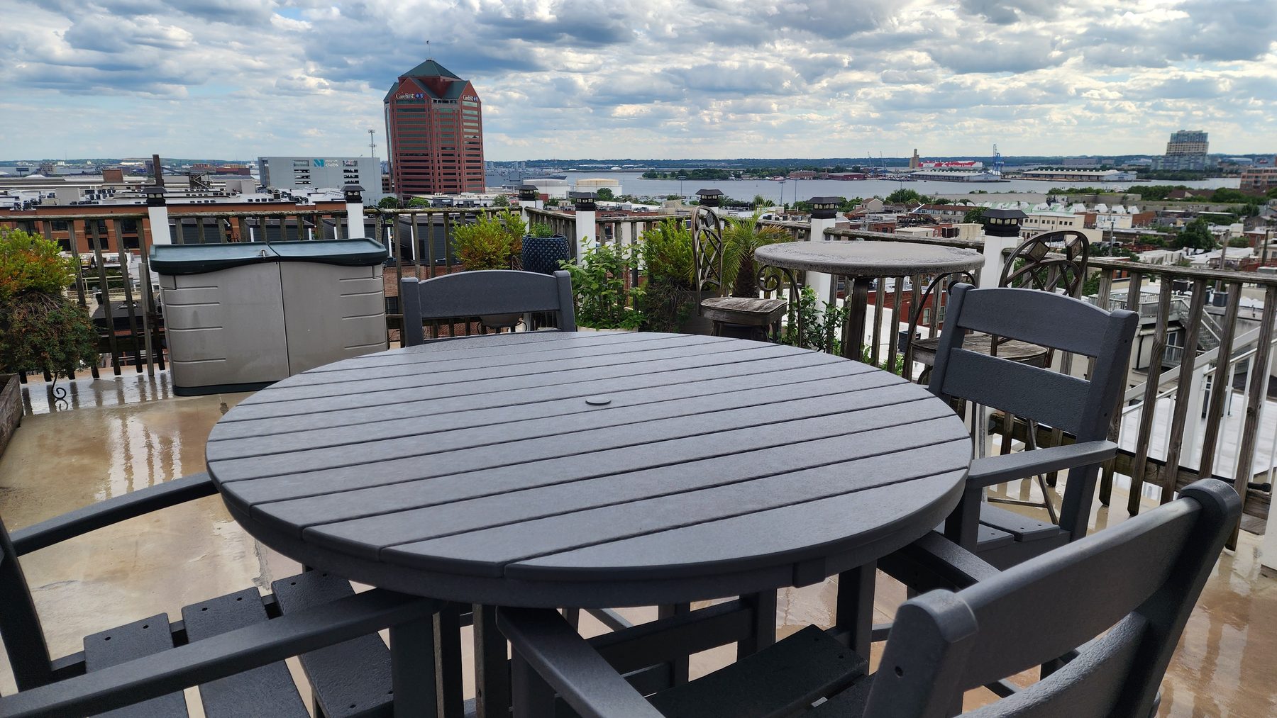 Private rooftop deck with harbor view and outdoor dining table
